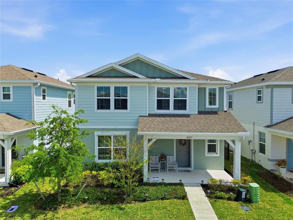 4071 Feather Tree Drive Apopka, FL 32712 - Photo 1 of 52 a front view of a house with garden