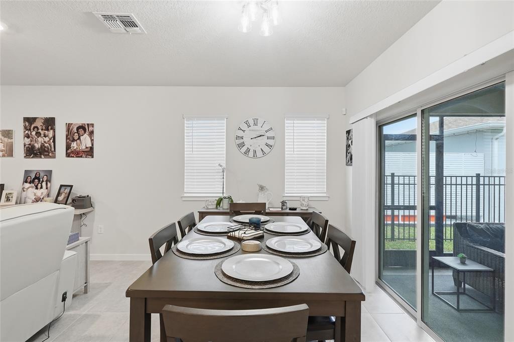 4071 Feather Tree Drive Apopka, FL 32712 - Photo 13 of 52 a dining room with furniture and a window