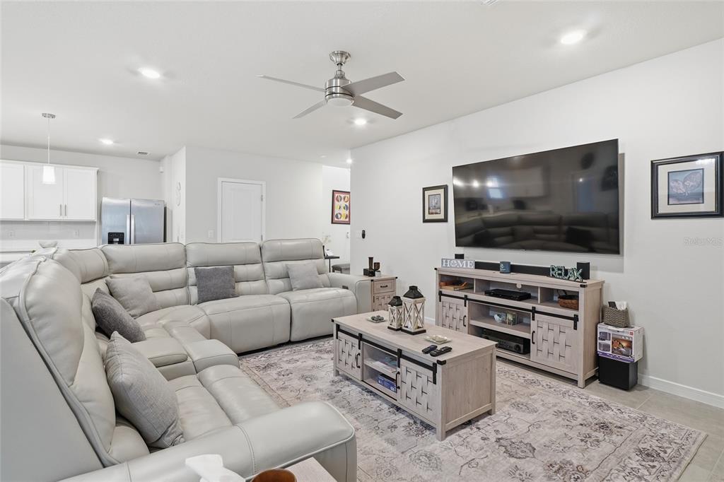 4071 Feather Tree Drive Apopka, FL 32712 - Photo 16 of 52 a living room with furniture and a flat screen tv