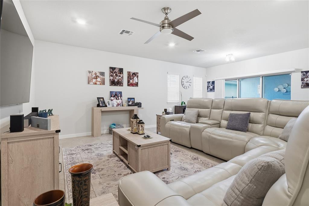4071 Feather Tree Drive Apopka, FL 32712 - Photo 17 of 52 a living room with furniture and a view of kitchen