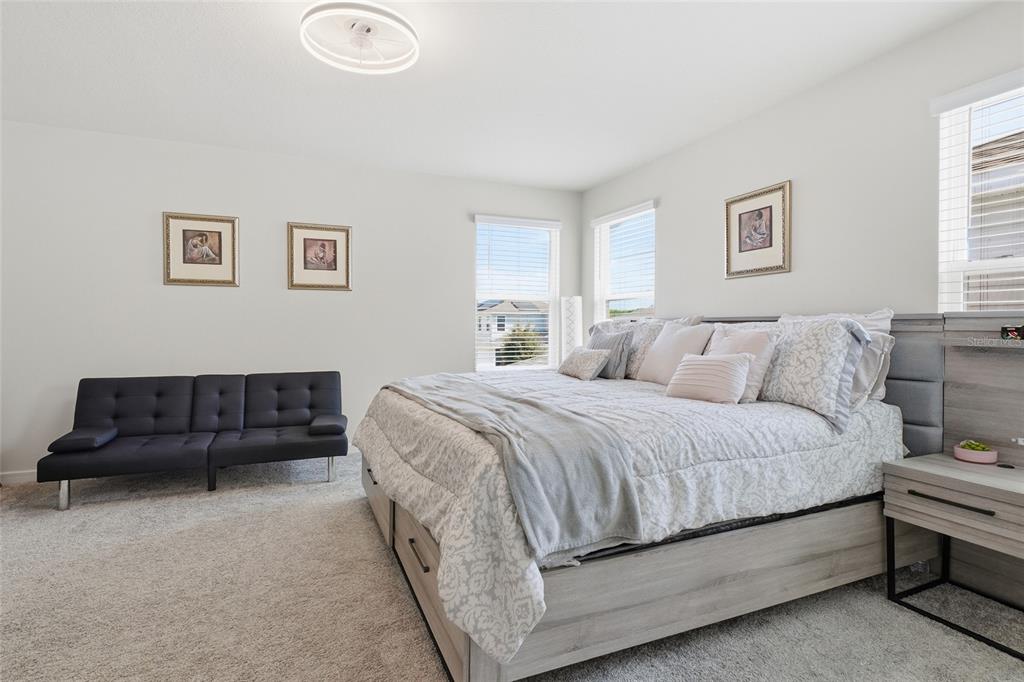 4071 Feather Tree Drive Apopka, FL 32712 - Photo 24 of 52 a bedroom with bed and a couch
