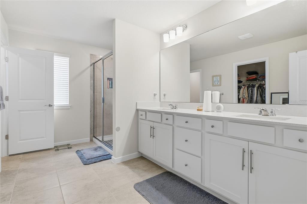 4071 Feather Tree Drive Apopka, FL 32712 - Photo 28 of 52 a spacious bathroom with a double vanity sink mirror and
