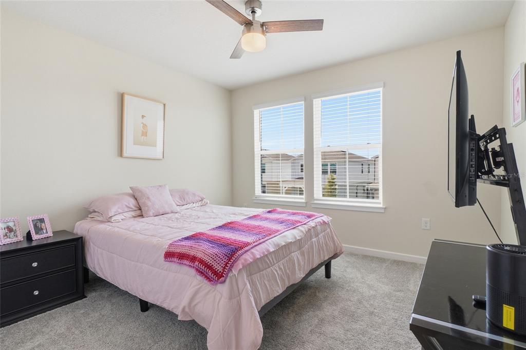 4071 Feather Tree Drive Apopka, FL 32712 - Photo 30 of 52 a bedroom with a bed and a window