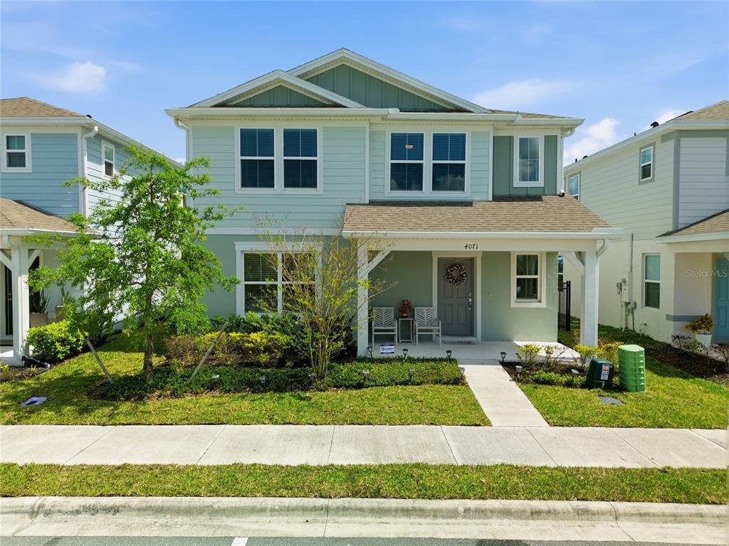 4071 Feather Tree Drive Apopka, FL 32712 - Photo 36 of 52 a front view of a house with a yard
