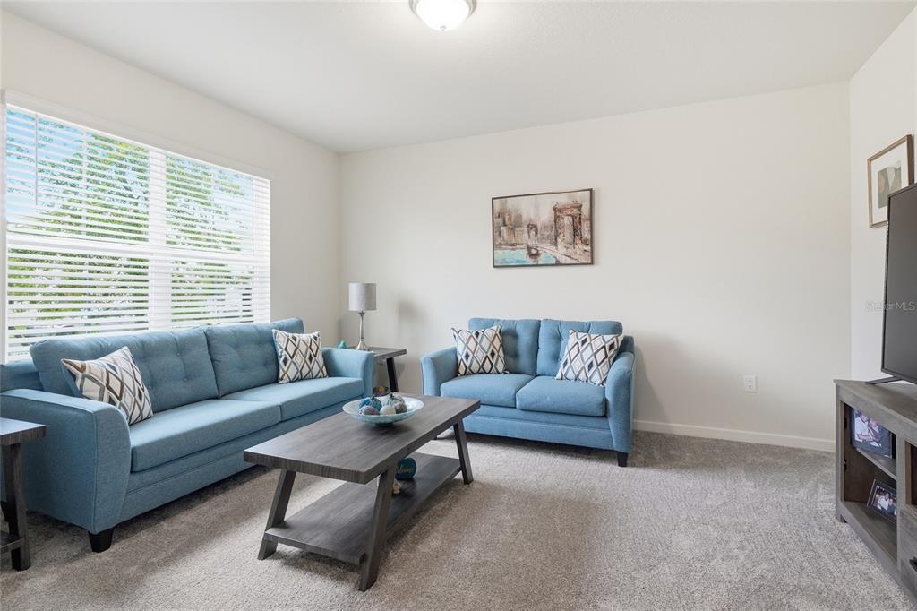 4071 Feather Tree Drive Apopka, FL 32712 - Photo 4 of 52 a living room with furniture and a window