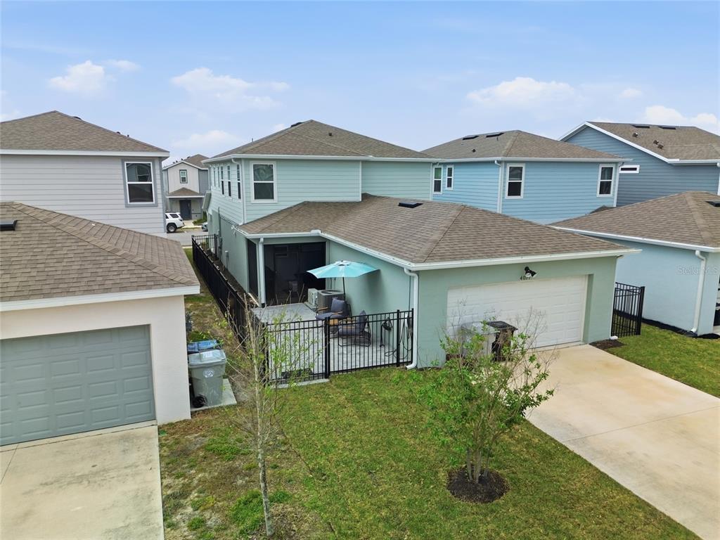 4071 Feather Tree Drive Apopka, FL 32712 - Photo 45 of 52 a front view of a house with a yard and garage