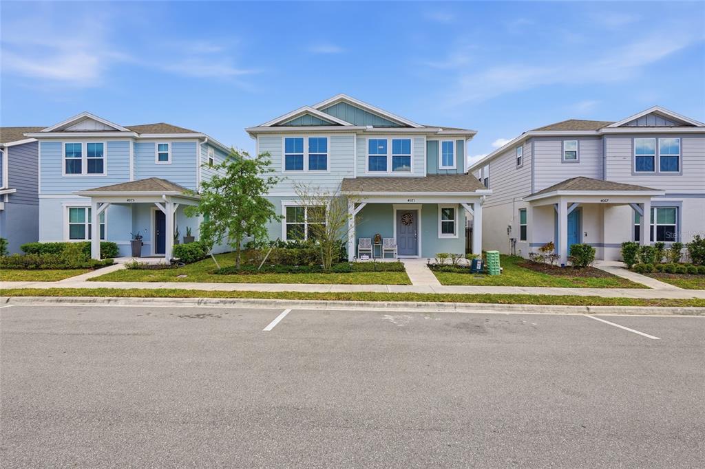 4071 Feather Tree Drive Apopka, FL 32712 - Photo 47 of 52 a view of an house with a swimming pool and a fire pit and a large tree