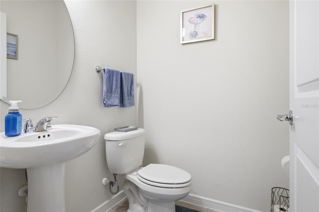 4071 Feather Tree Drive Apopka, FL 32712 - Photo 6 of 52 a bathroom with a toilet sink and mirror