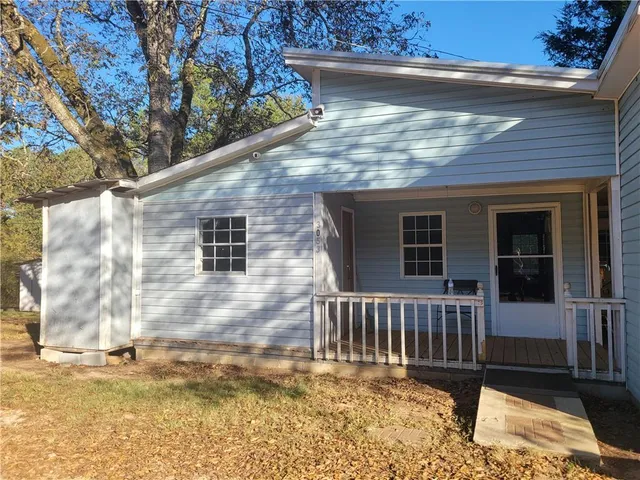 a porch with view of the house