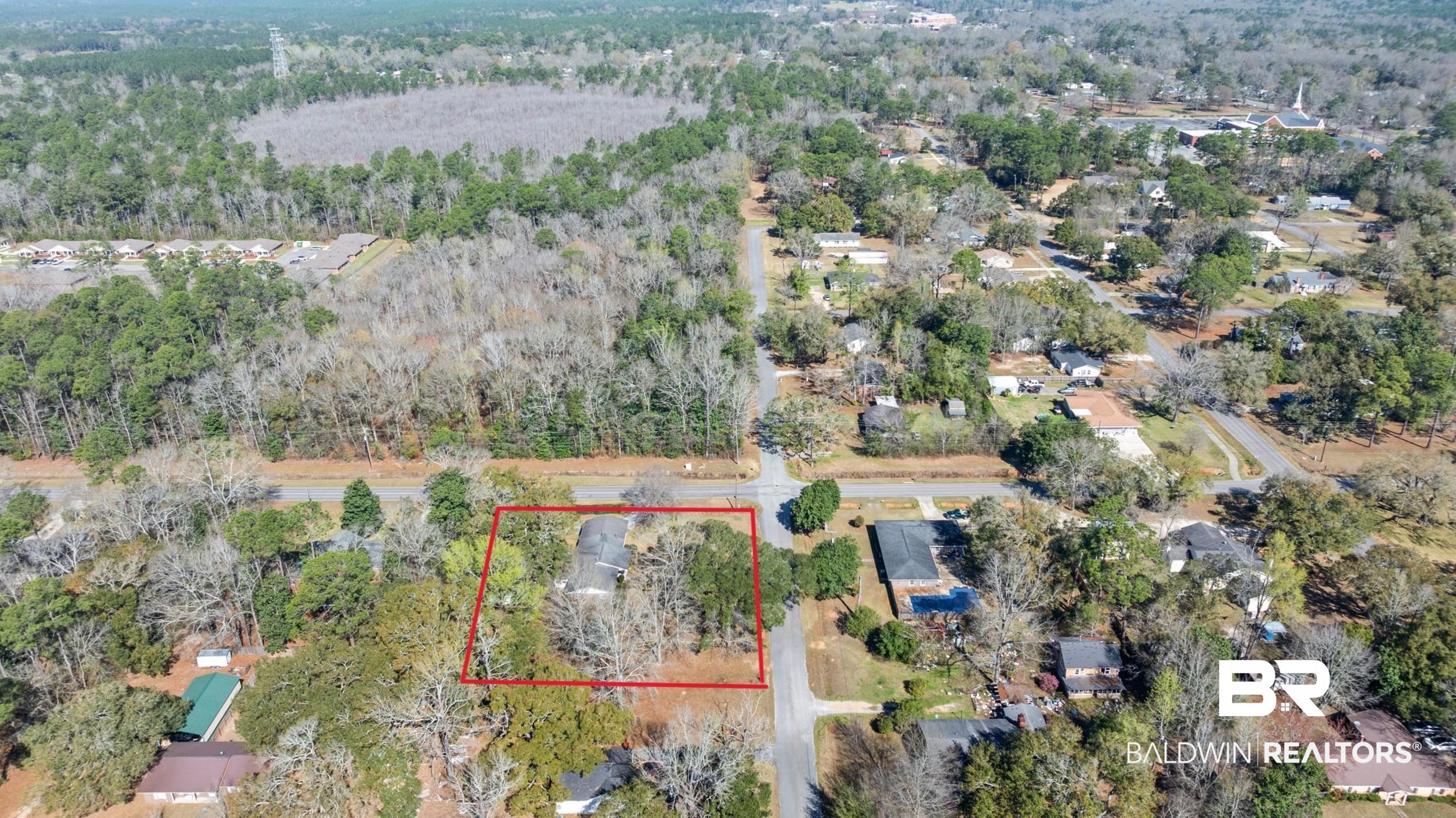 809 Moog Avenue Bay Minette, AL 36507 - Photo 29 of 33 Aerial overview of property's location featuring property boundaries highlighted and a heavily wooded area