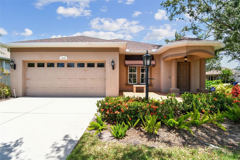 1415 Millbrook Circle Bradenton, FL 34212 - Photo 1 of 1 a front view of a house with a yard