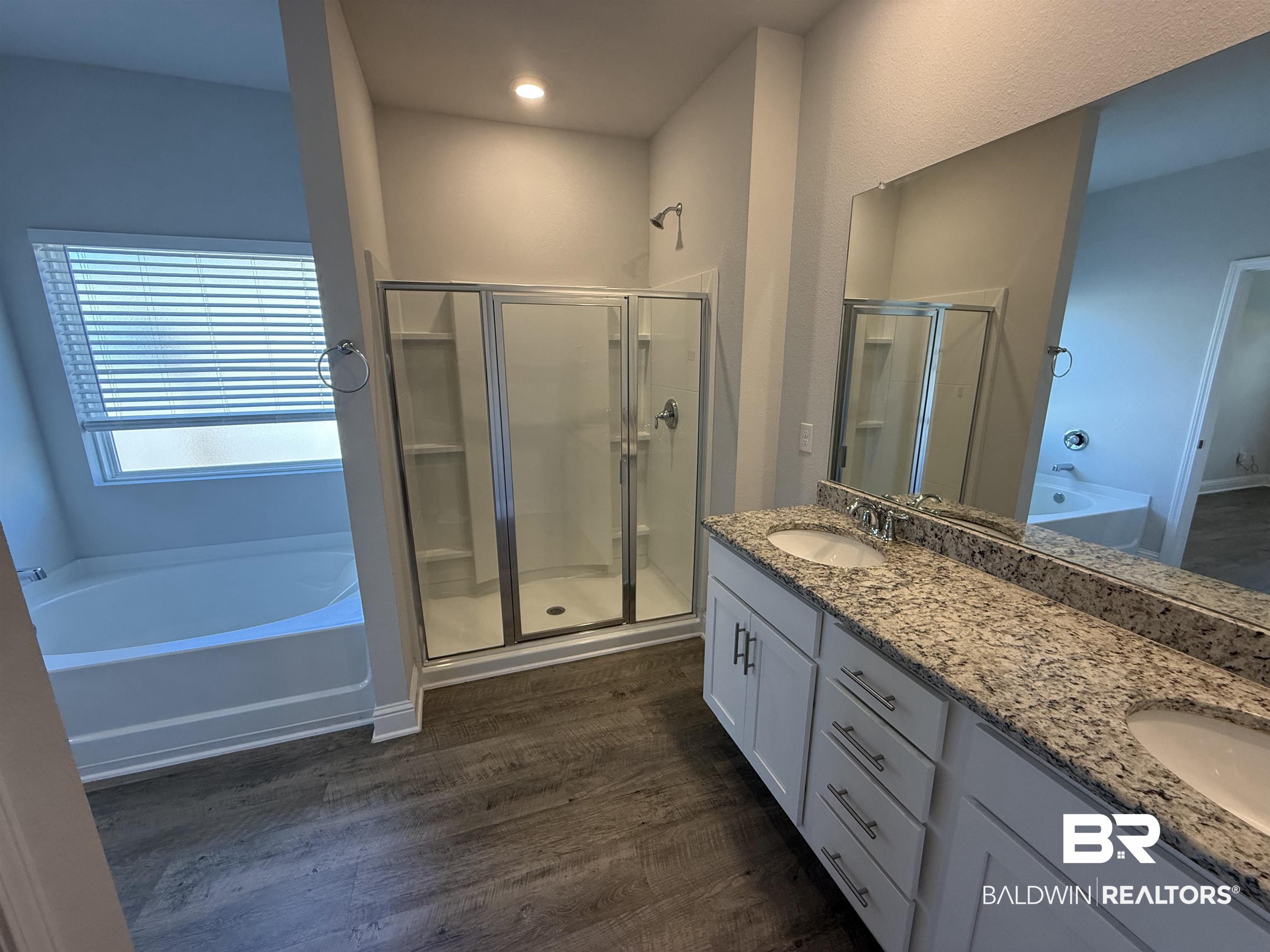 23247 Lieutenant Avenue Foley, AL 36535 - Photo 32 of 47 Dual vanity with granite countertop, undermount sinks, and chrome fixtures