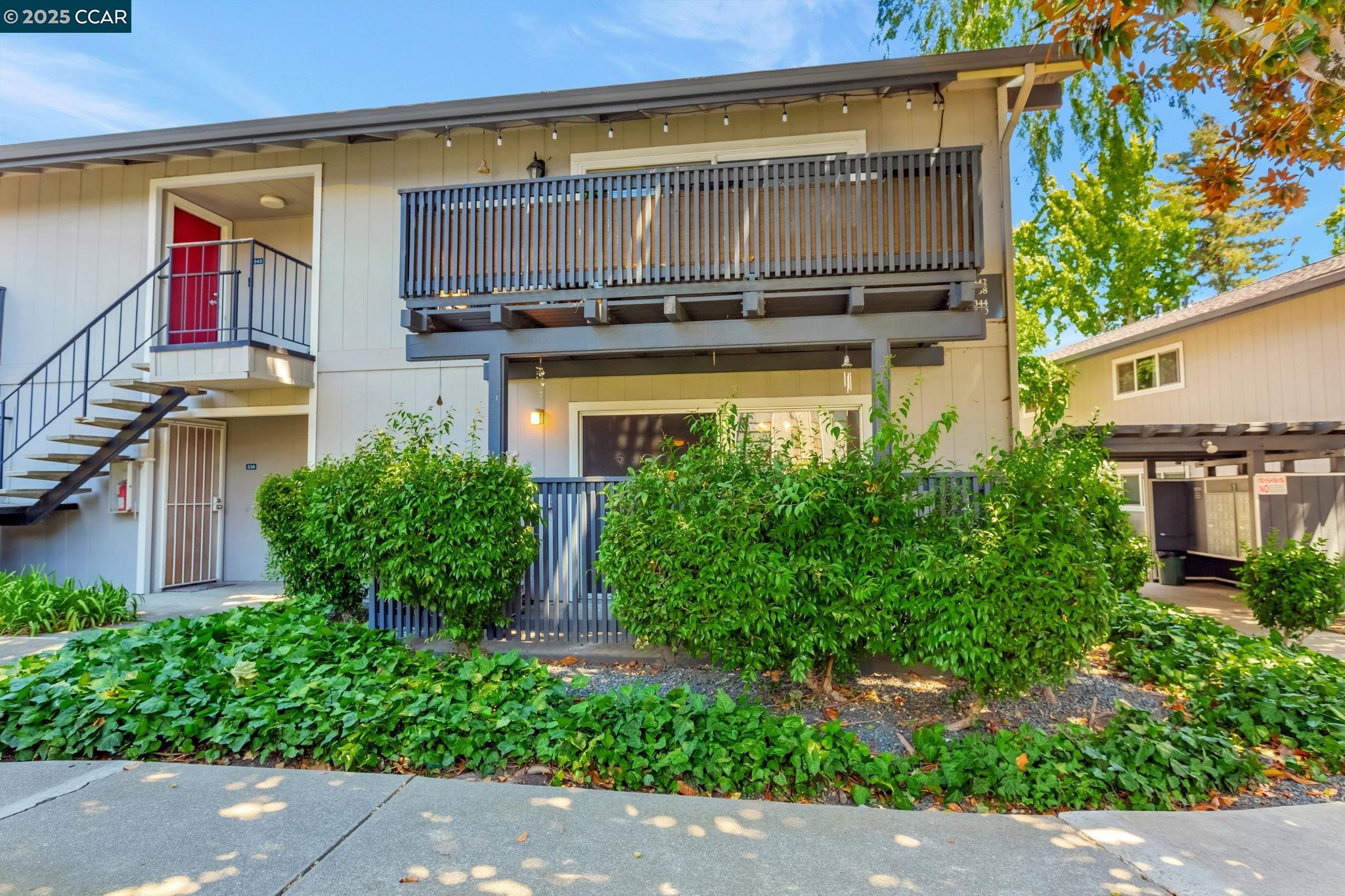 a view of a building with potted plants