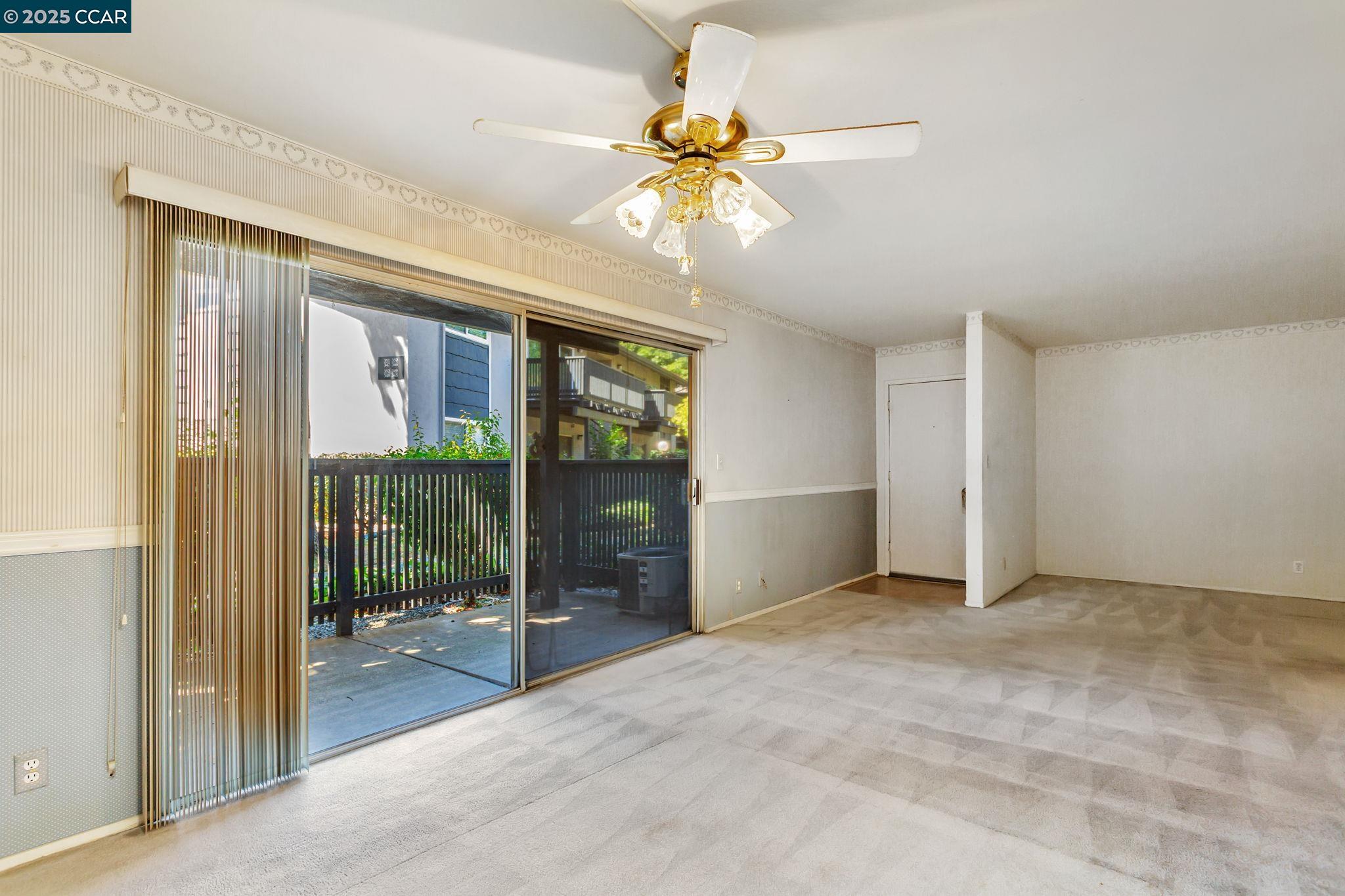 9085 Alcosta Boulevard, Unit 340 San Ramon, CA 94583 - Photo 11 of 25 a view of an empty room with a balcony