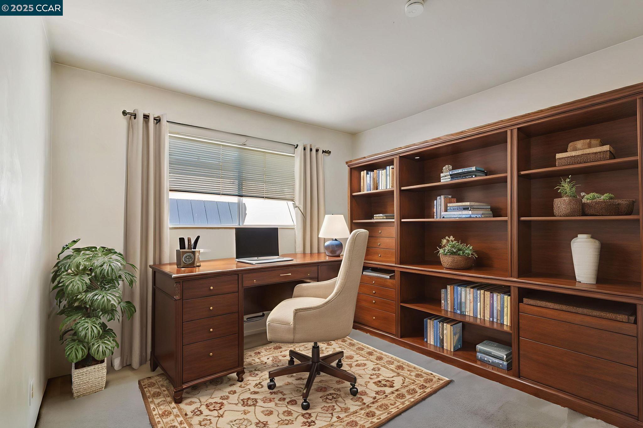 9085 Alcosta Boulevard, Unit 340 San Ramon, CA 94583 - Photo 15 of 25 a room with furniture and a book shelf