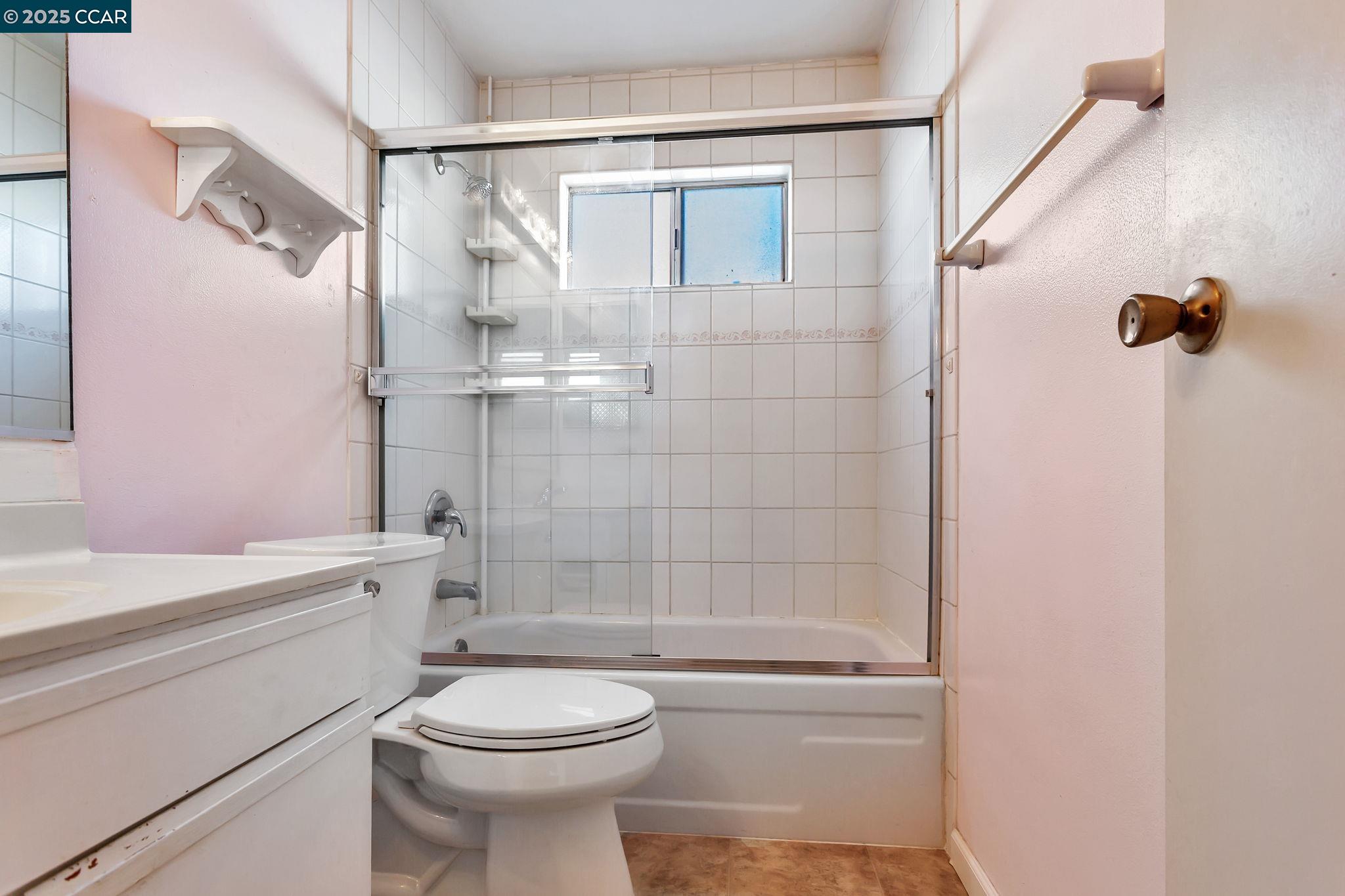 9085 Alcosta Boulevard, Unit 340 San Ramon, CA 94583 - Photo 17 of 25 a bathroom with a toilet sink and shower