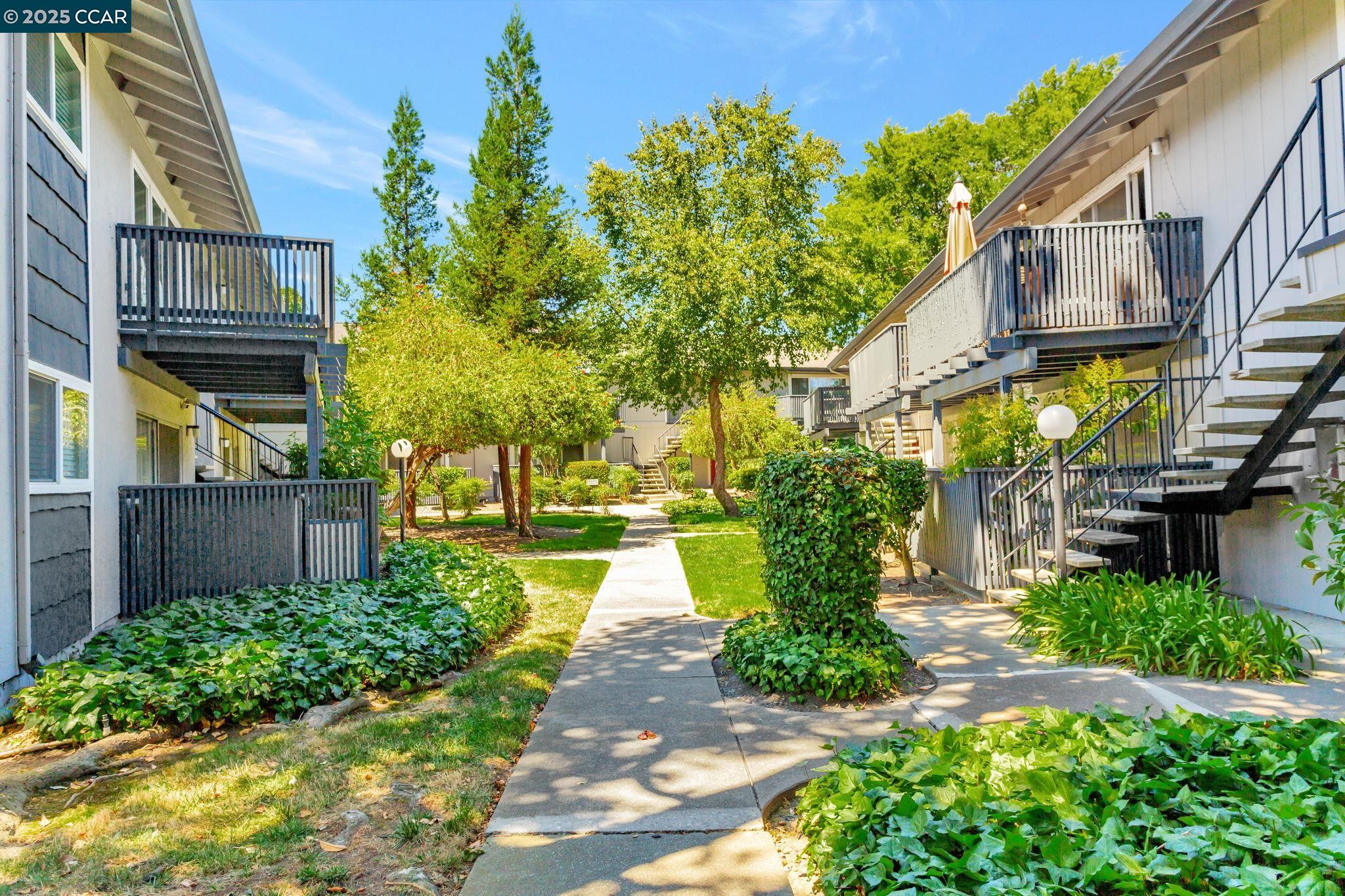 9085 Alcosta Boulevard, Unit 340 San Ramon, CA 94583 - Photo 21 of 25 front view of a house with a yard