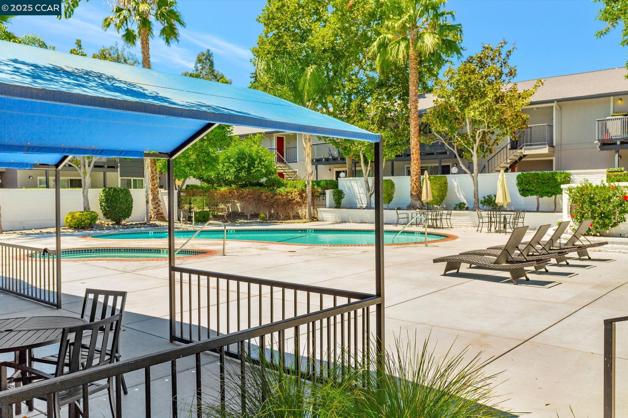 9085 Alcosta Boulevard, Unit 340 San Ramon, CA 94583 - Photo 23 of 25 a view of a patio with a table chairs and backyard