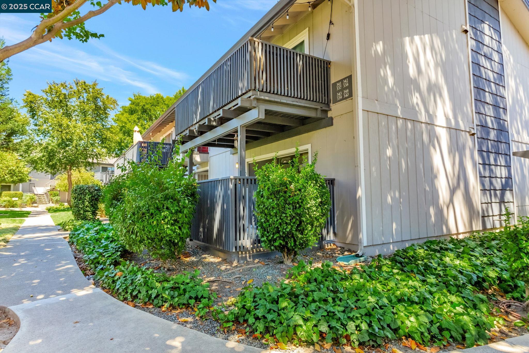 9085 Alcosta Boulevard, Unit 340 San Ramon, CA 94583 - Photo 3 of 25 a view of a house with a yard