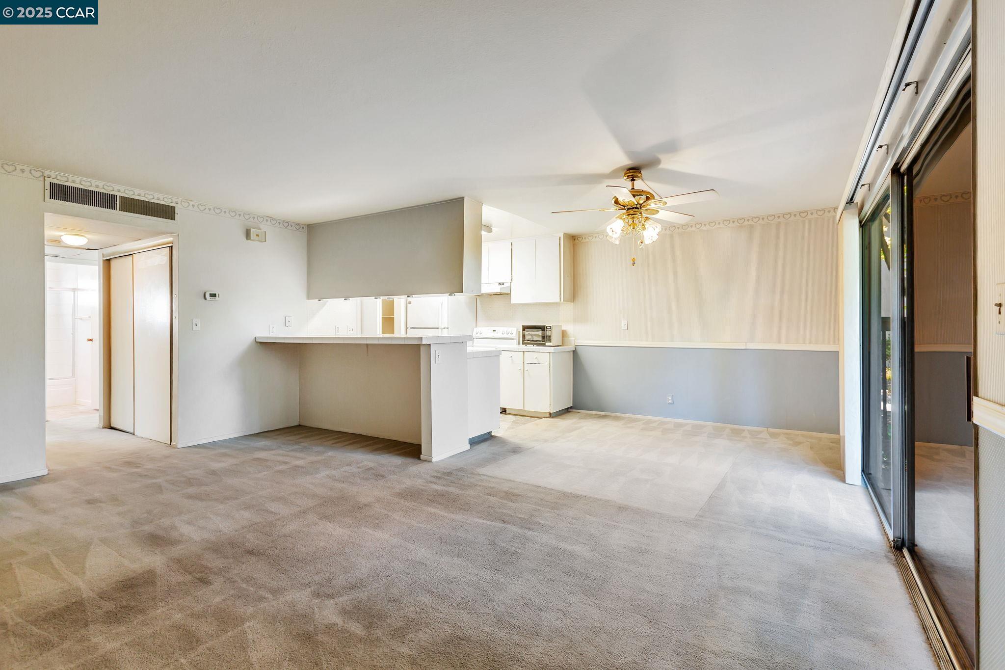 9085 Alcosta Boulevard, Unit 340 San Ramon, CA 94583 - Photo 6 of 25 a view of a kitchen with a sink cabinets and a window