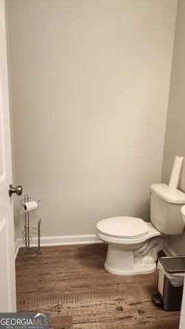 a bathroom with a toilet and a sink