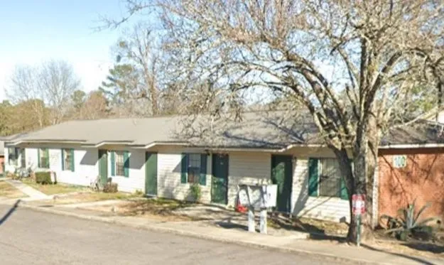 a view of a building with tree s