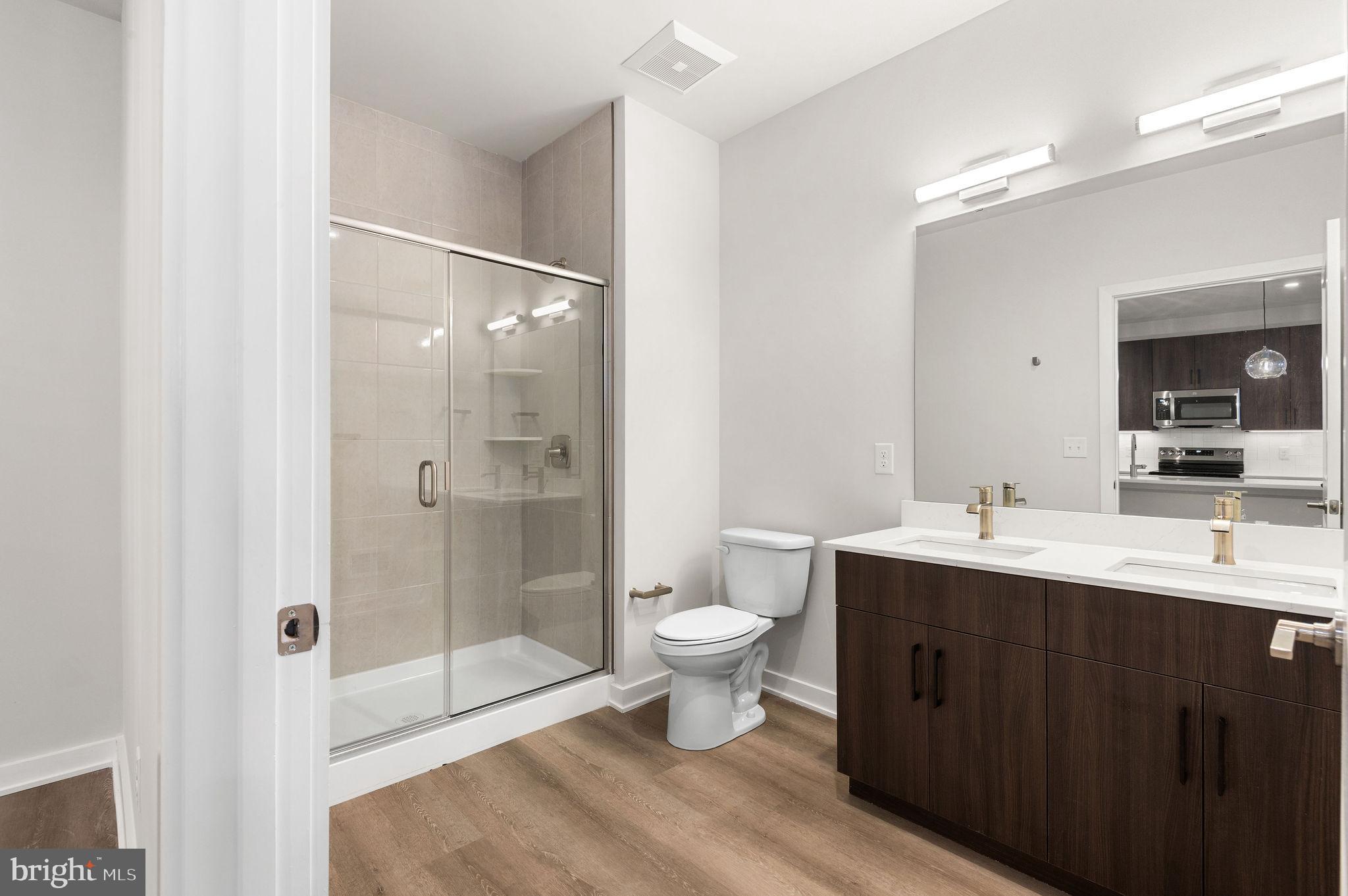 26 South York Road, Unit 204 Hatboro, PA 19040 - Photo 11 of 48 a bathroom with a sink a toilet and shower