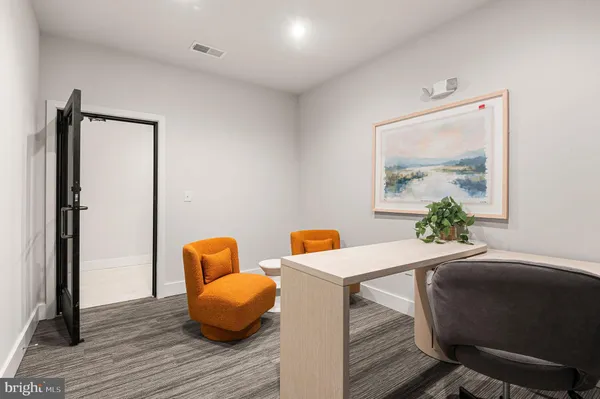 a view of a livingroom with furniture and staircase