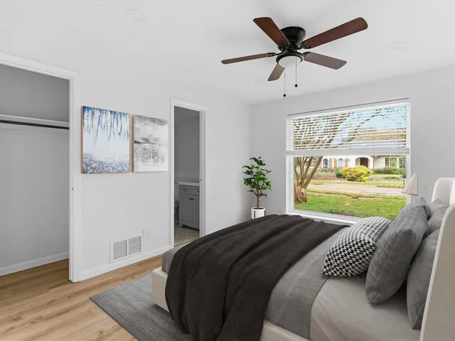 a bedroom with a bed and window