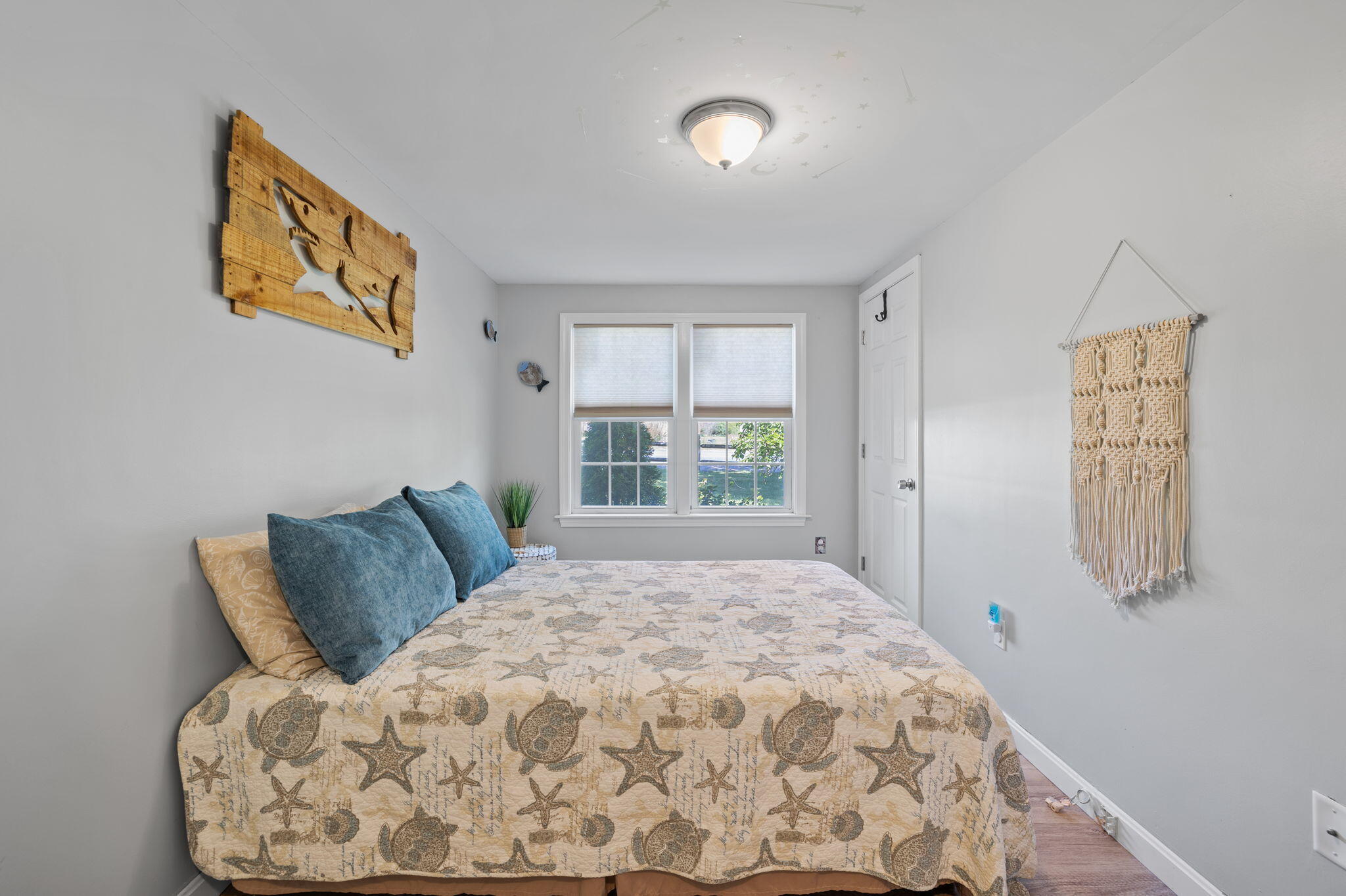 120 Puritan Road Buzzards Bay, MA 02532 - Photo 13 of 28 a large bed sitting in a bedroom next to a window