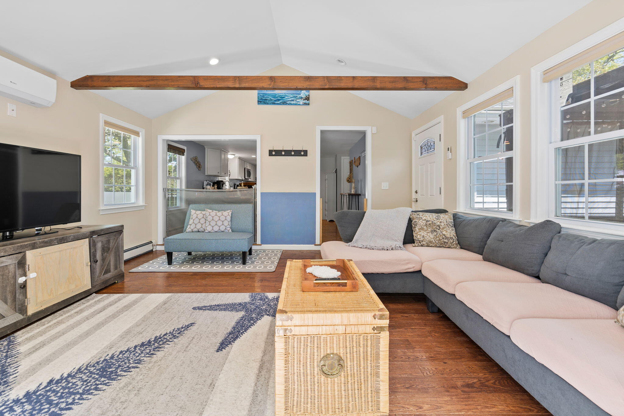 120 Puritan Road Buzzards Bay, MA 02532 - Photo 5 of 28 a living room with a couch and a flat screen tv