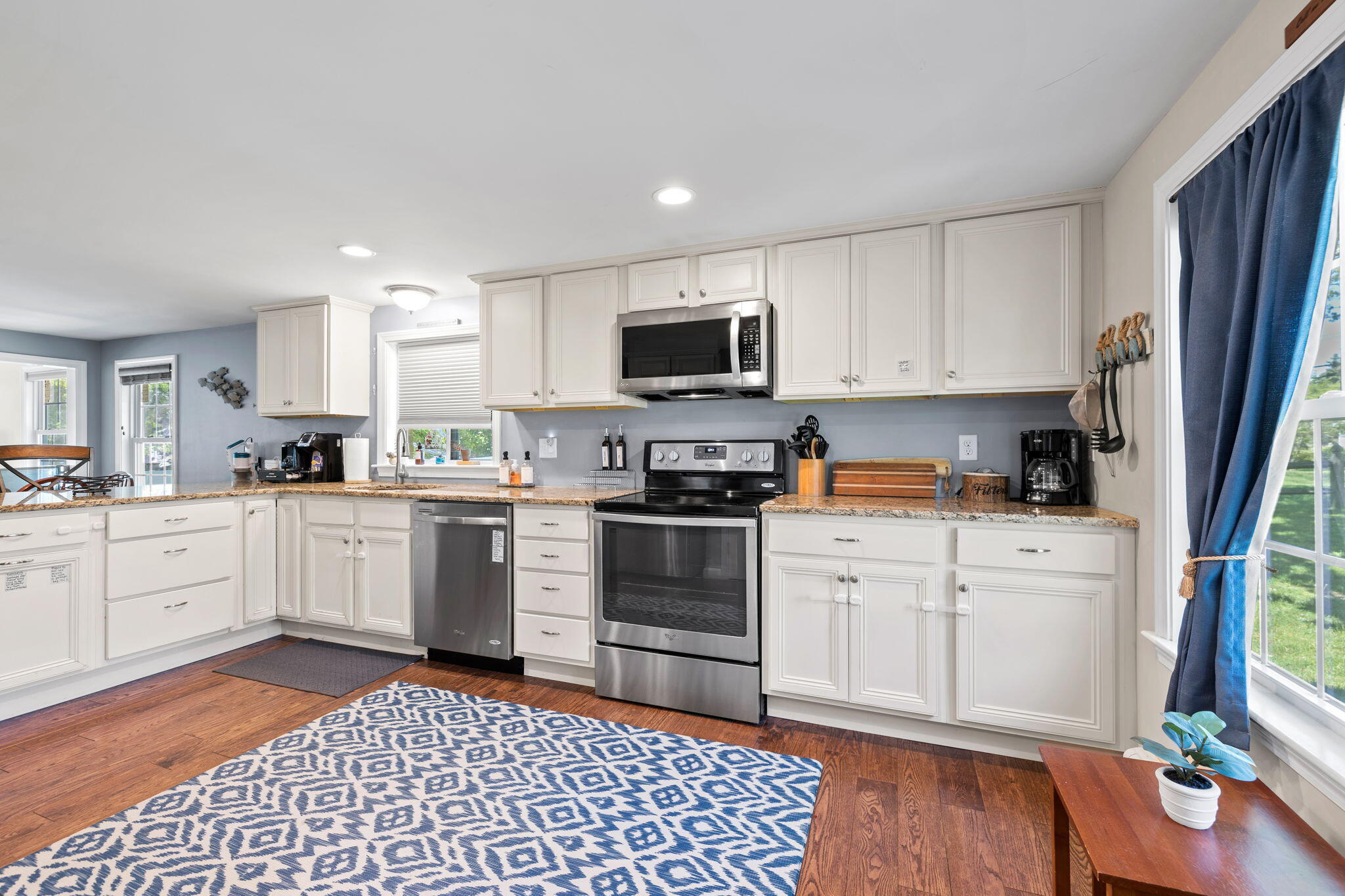 120 Puritan Road Buzzards Bay, MA 02532 - Photo 7 of 28 a kitchen with granite countertop a refrigerator stove top oven and sink