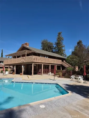 a view of a house with a yard in the background