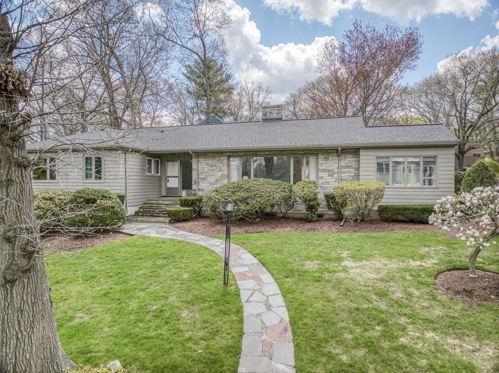 18 Apache Trail Arlington, MA 02474 - Photo 1 of 30 front view of a house with a yard