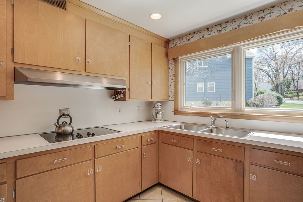 18 Apache Trail Arlington, MA 02474 - Photo 12 of 30 a kitchen with a sink and cabinets