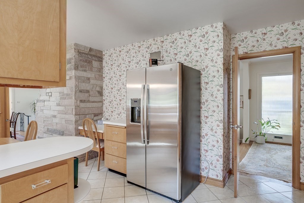 18 Apache Trail Arlington, MA 02474 - Photo 13 of 30 a kitchen with stainless steel appliances a refrigerator and a sink