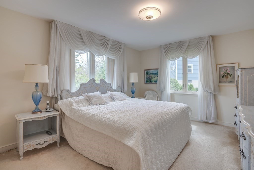 18 Apache Trail Arlington, MA 02474 - Photo 20 of 30 a bedroom with a bed and a window