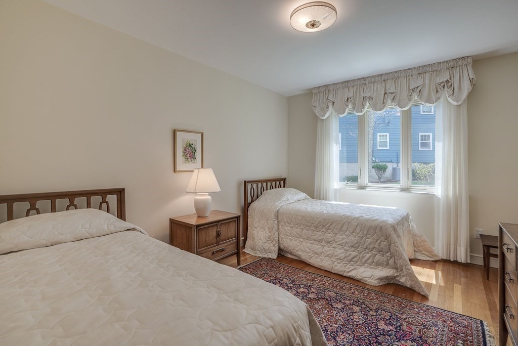 18 Apache Trail Arlington, MA 02474 - Photo 21 of 30 a bedroom with two beds and a window