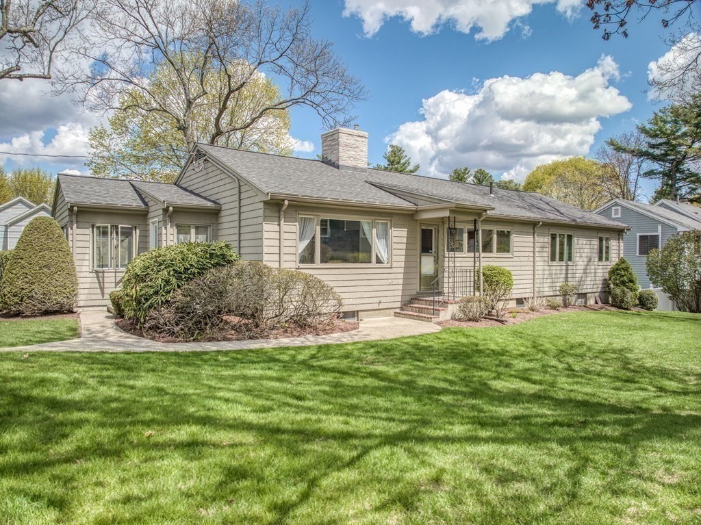 18 Apache Trail Arlington, MA 02474 - Photo 24 of 30 a front view of house with yard and green space