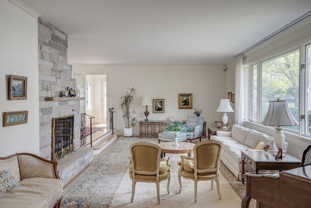 18 Apache Trail Arlington, MA 02474 - Photo 4 of 30 a living room with furniture fireplace and a large window