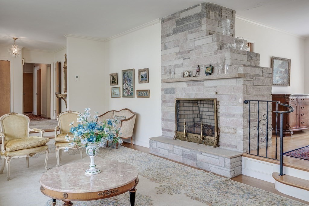 18 Apache Trail Arlington, MA 02474 - Photo 5 of 30 a dining room with furniture and a fireplace