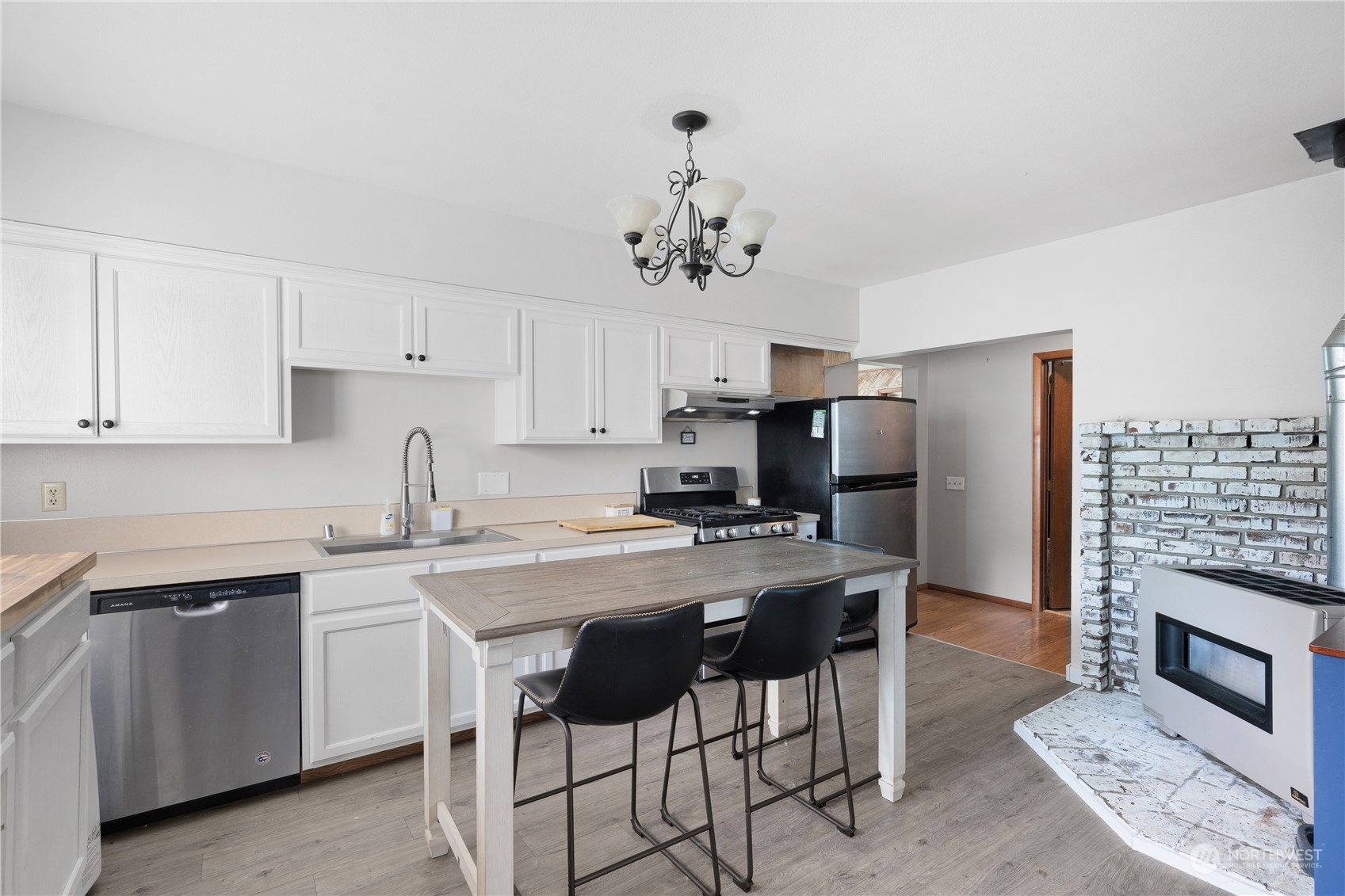 406 Cleveland Sumas, WA 98295 - Photo 13 of 33 a kitchen with a sink cabinets and stainless steel appliances