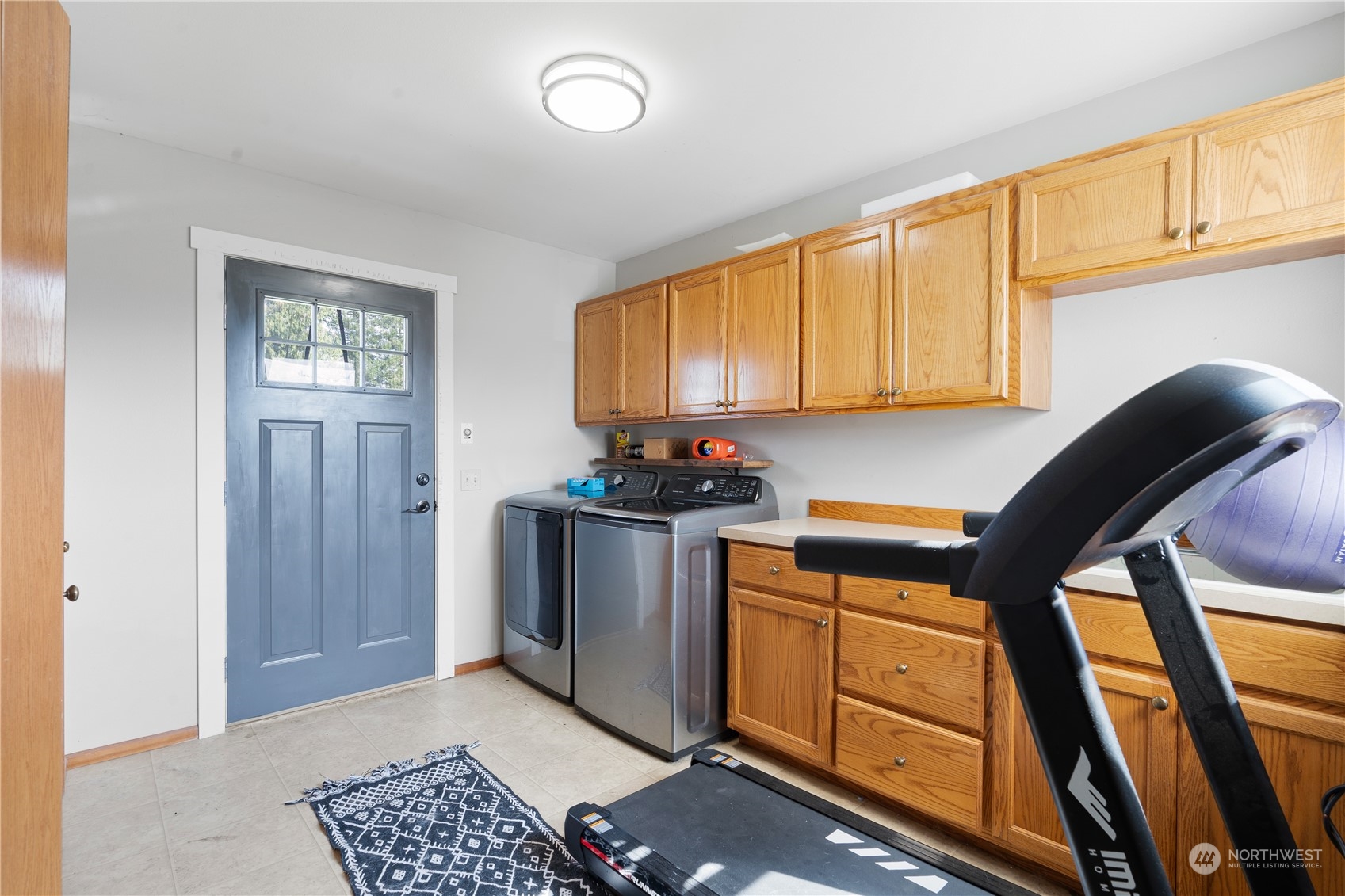 406 Cleveland Sumas, WA 98295 - Photo 23 of 33 a kitchen with stainless steel appliances granite countertop a stove a sink and a microwave