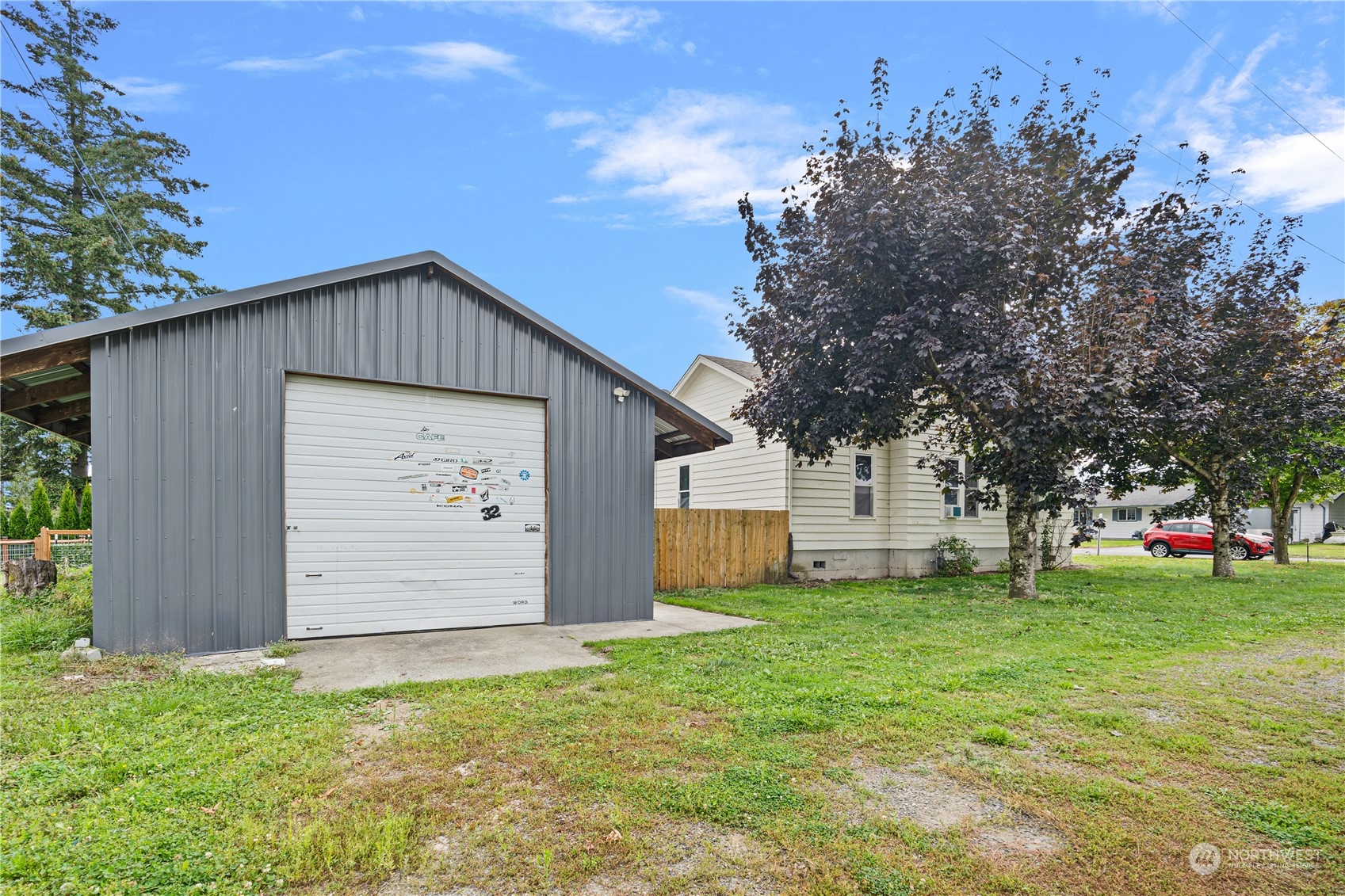 406 Cleveland Sumas, WA 98295 - Photo 29 of 33 a front view of house with yard and trees