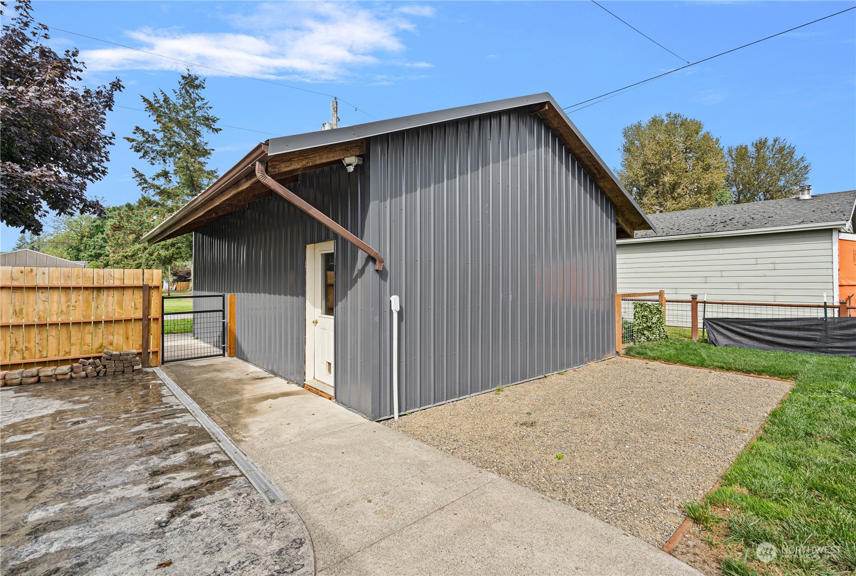 406 Cleveland Sumas, WA 98295 - Photo 31 of 33 a front view of a house with a yard and garage