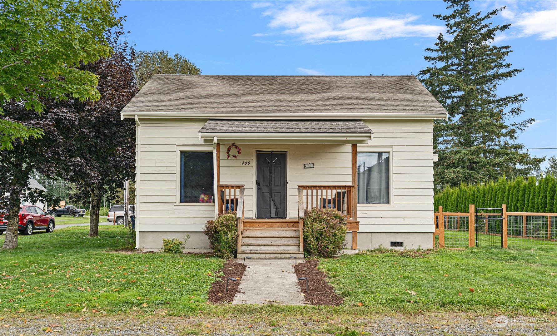 406 Cleveland Sumas, WA 98295 - Photo 6 of 33 a front view of a house with a yard