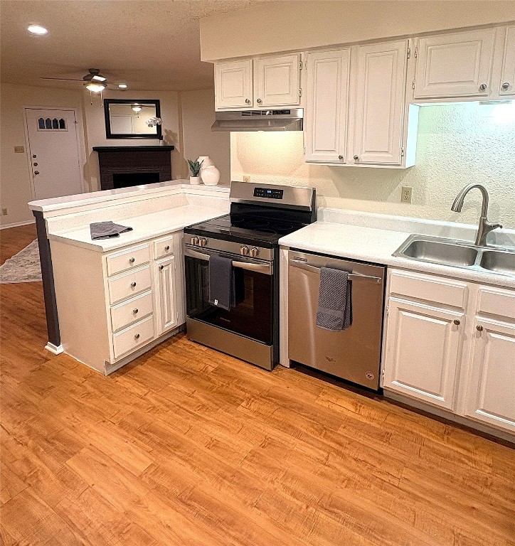 503 Algerita Drive, Unit B Georgetown, TX 78628 - Photo 13 of 30 a kitchen with a stove top oven sink and cabinets