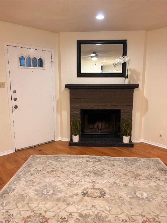503 Algerita Drive, Unit B Georgetown, TX 78628 - Photo 4 of 30 a view of empty room with wooden floor and fireplace