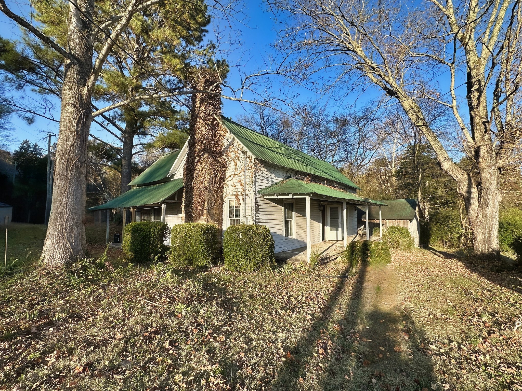 a front view of house with a garden