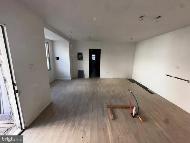 a view of a livingroom with wooden floor